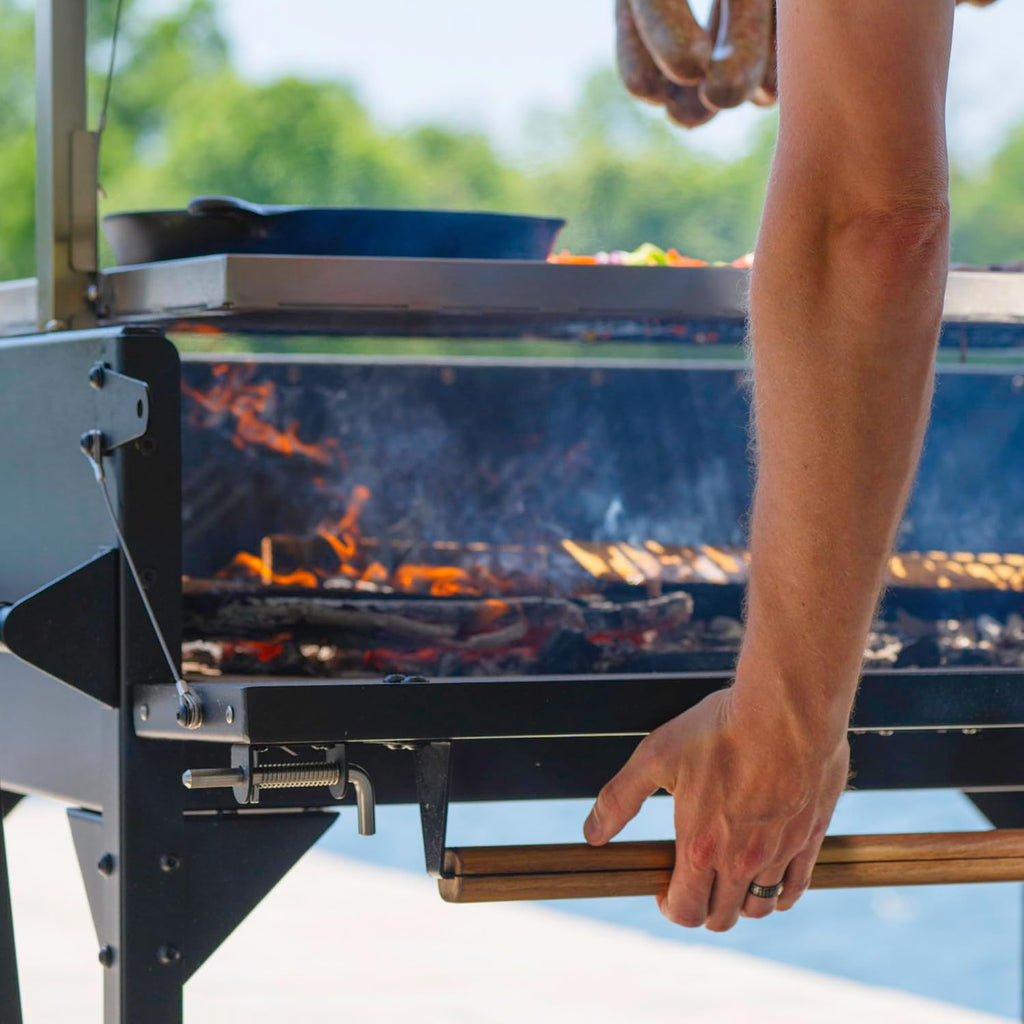 Backyard Discovery Argentine Santa Maria Heritage Wood Fire & Charcoal BBQ Grill with Adjustable Grill Grates, Fire Bricks, Heavy-Duty Steel, S-Hooks, Acacia Wood Table for Outdoor Gaucho Grilling