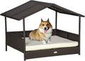 PawHut Wicker Dog House Outdoor with Canopy, Rattan Dog Bed with Water-Resistant Cushion, Raised Dog Bed for Small, Medium Dogs up to 66 lbs, 19.75" in Length, Brown Wicker, White Cushion