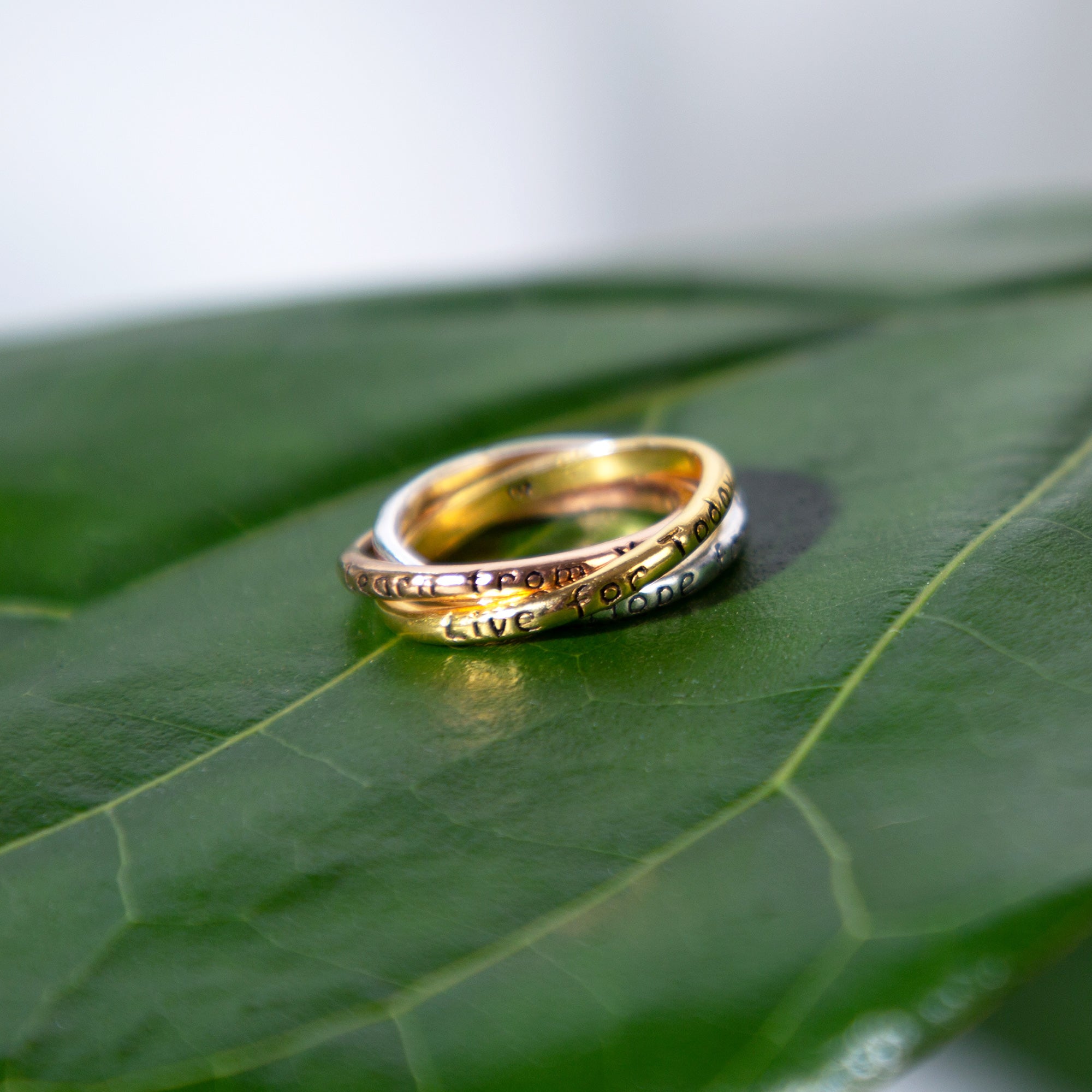 GreaterGood Daily Reminder Trio Fidget Ring in Sterling Silver, Gold, and Copper