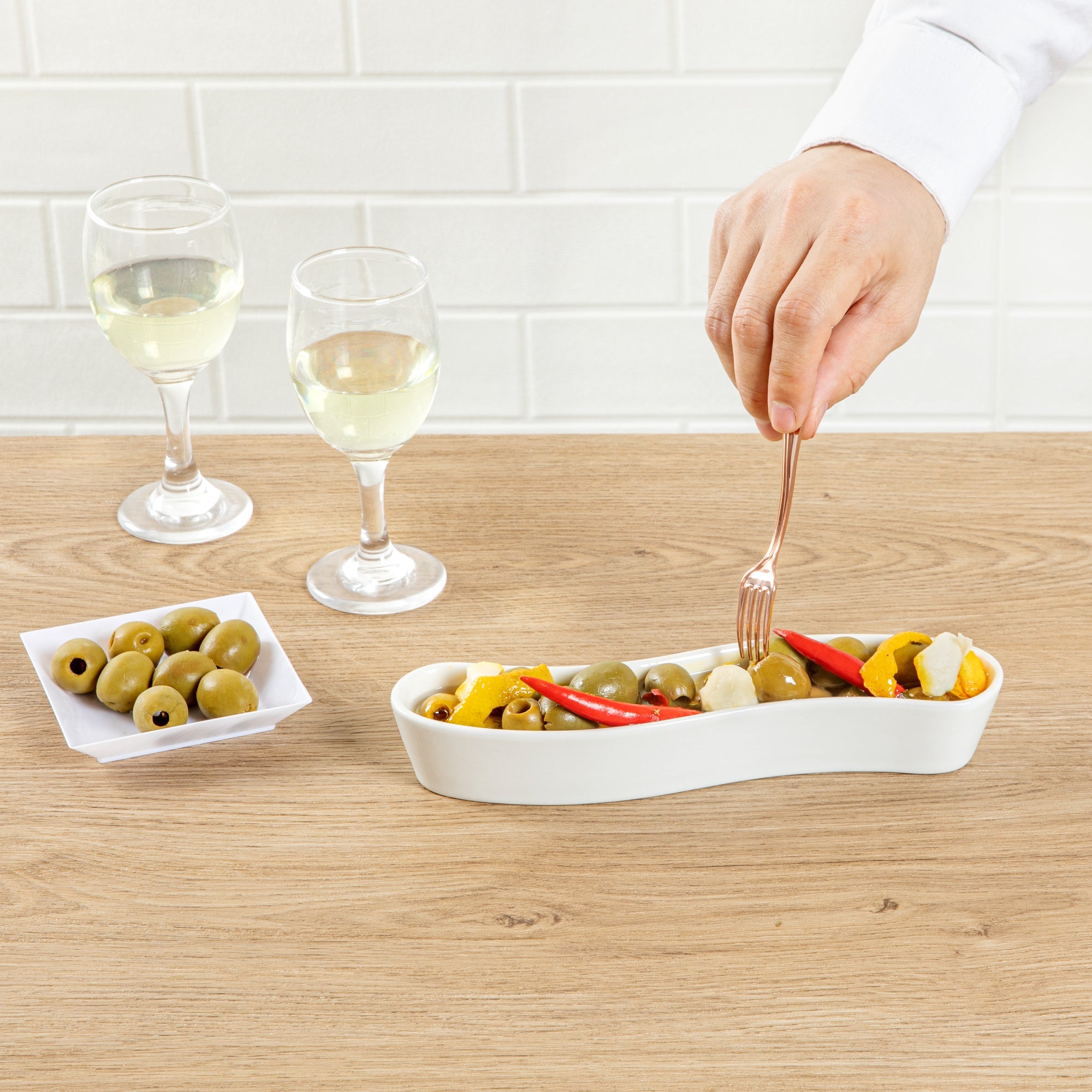 Chef 101 Swerve 6 oz Curved White Porcelain Olive Plate - 8 3/4" x 2 1/4" x 1 1/2" - 1 count box