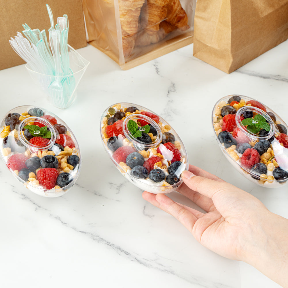 Mini Serve 6 oz Oval Clear Plastic Deli Cup - Stackable, with Lid - 5 1/2" x 3 1/4" x 2 1/2" - 100 count box