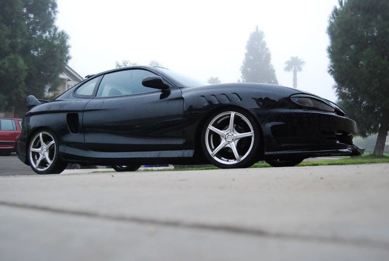 Megan Racing Coilover Damper Kit for Hyundai Tiburon 97-01 - 32-Level Adjustment, Camber Pillowball Front Mounts